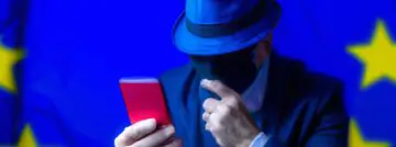 spy reading smartphone message EU flag