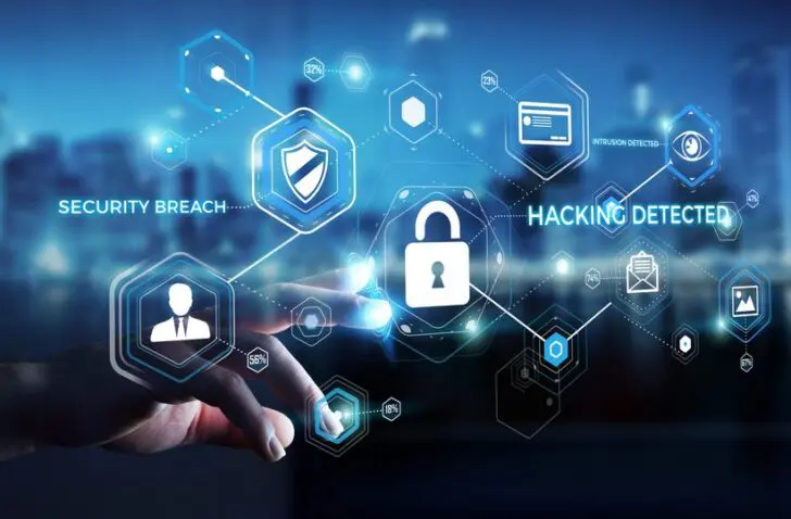 Businessman,On,Blurred,Background,Using,Antivirus,To,Block,A,Cyber