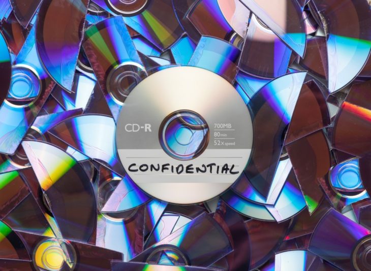 Cd,With,Confidential,Written,On,It,,With,Shredded,Cd's,And