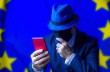 spy reading smartphone message EU flag